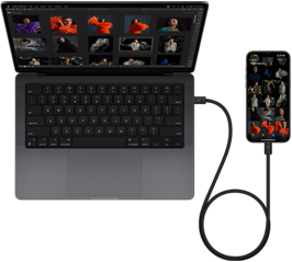 Un iPhone 15 Pro Max connecté à un MacBook Pro 14 pouces via USB-C